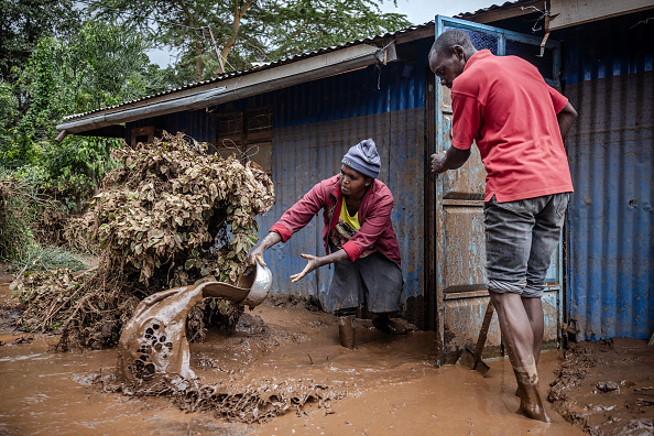 Smallholder farmer using mobile phone to receive drought early warning in Makueni County